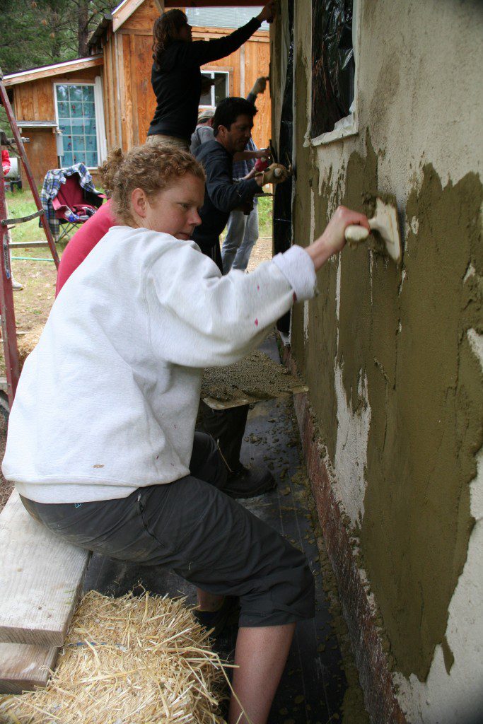 woman applying finish plaster