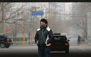 man walking through pollution
