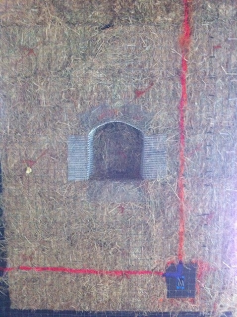electrical lines marked on a straw bale wall