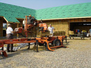 Portable saw mill cutting straw bales