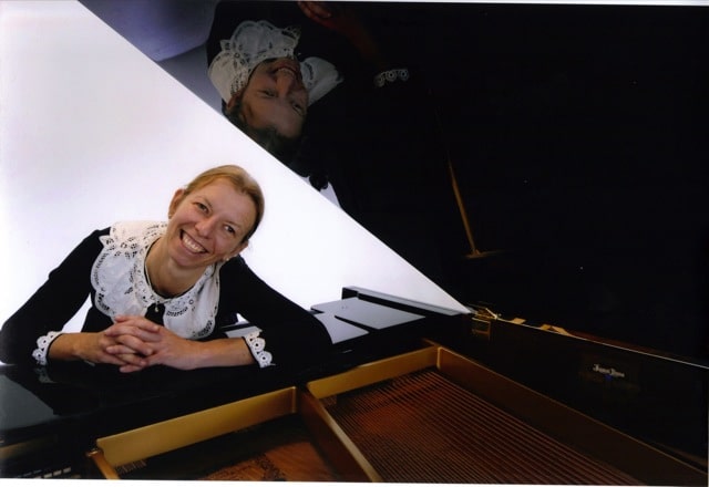 woman and grand piano