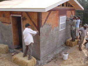 plaster application on straw bale house