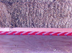 Moisture seal tape on a straw bale wall