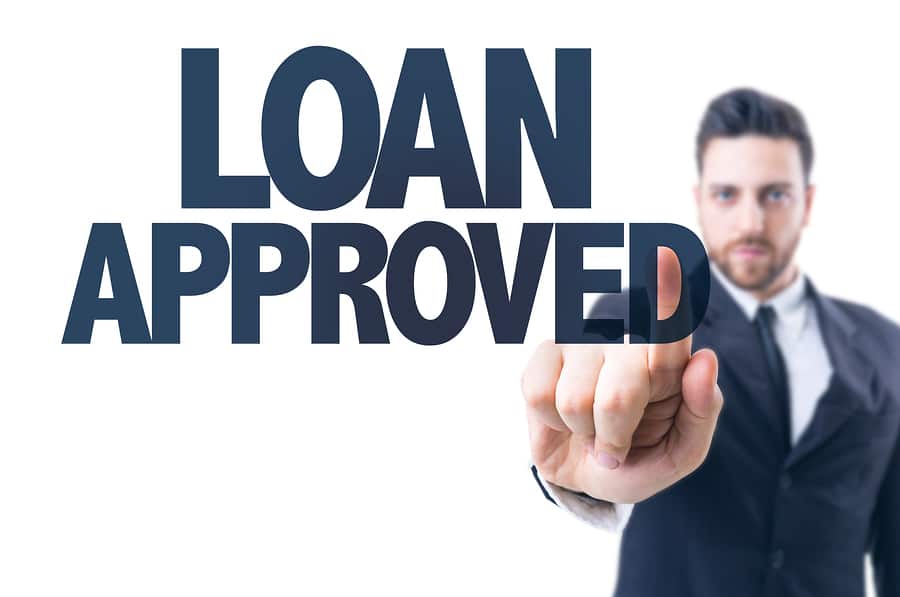 Business man pointing the text: Loan Approved