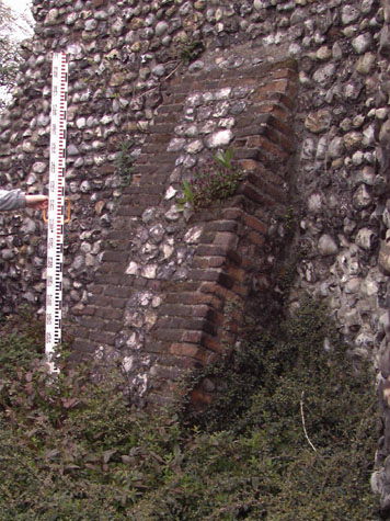 old stone buttress wall