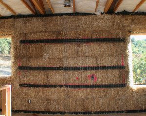 cabinet backing on straw bale wall