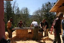 people on straw bale workshop site