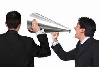 men speaking into megaphone