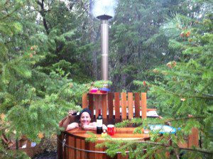woman in wood fired hot tub