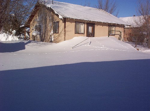 snow drift on straw bale house