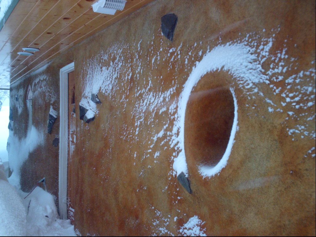 straw bale house exterior in snow
