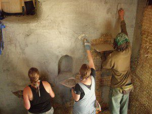 Plastering straw bale house with lime 